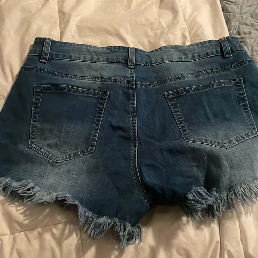Size large cut off Jean shorts with fraying